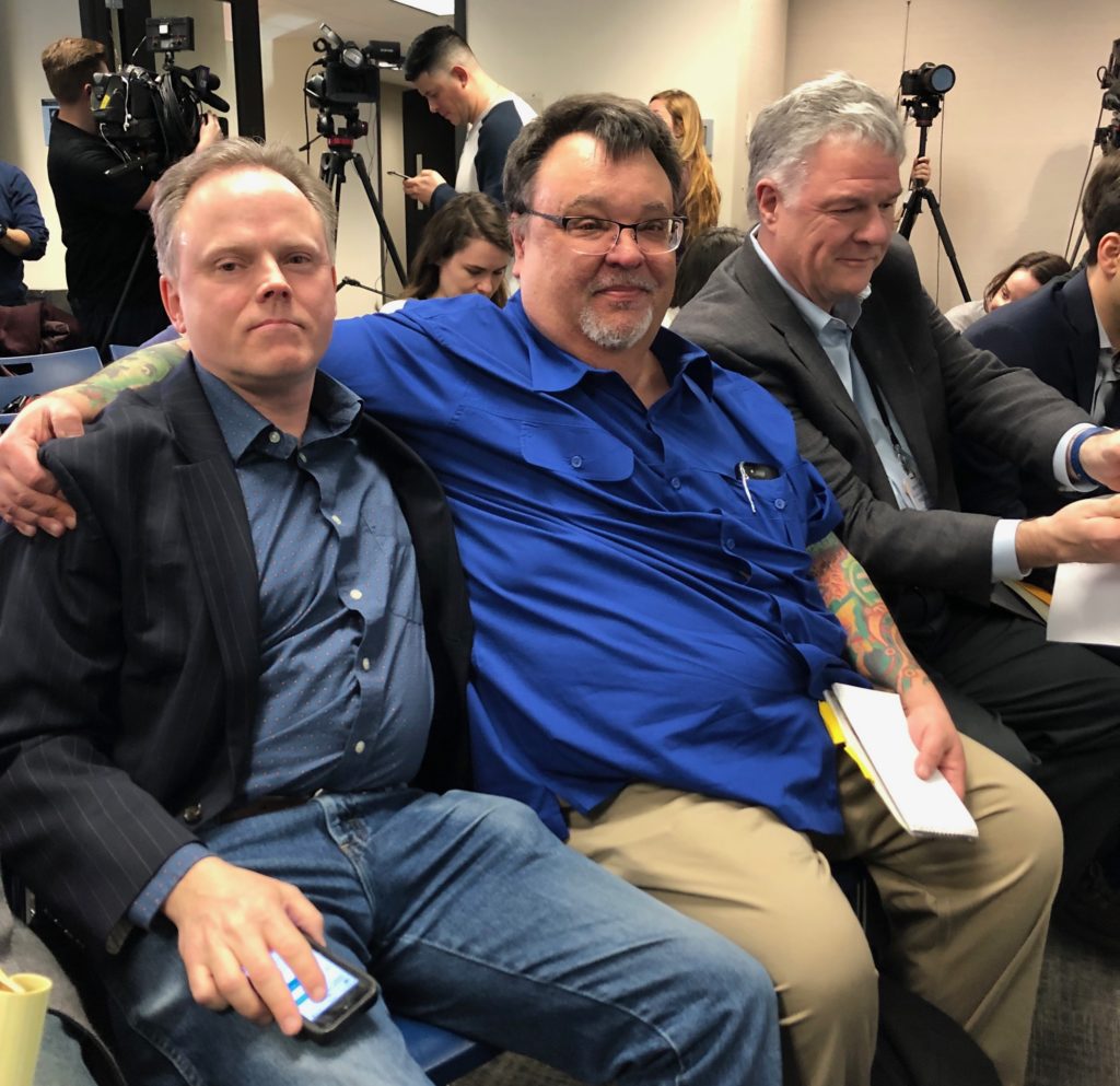 Abdon Pallasch and Jim DeRogatis wait for the start of the press conference announcing charges against singer R. Kelly. (Photo by Bob Chiarito)